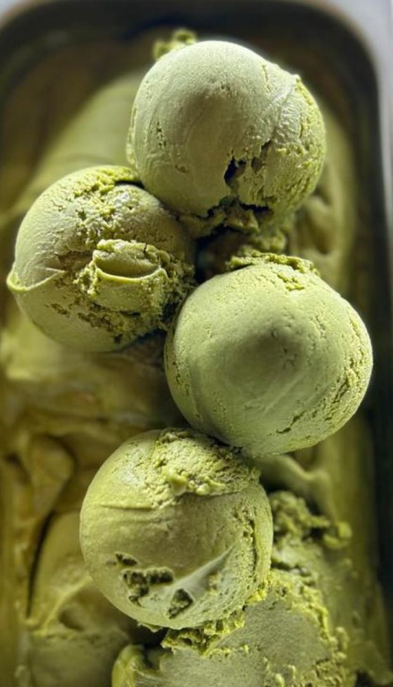 Scoops of Loving Caf&eacute; matcha ice cream in the tub